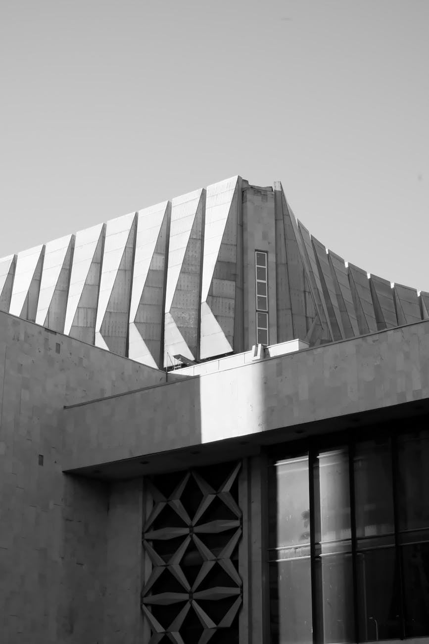 Dynamic black and white capture of modern architectural design, showcasing structural elegance.