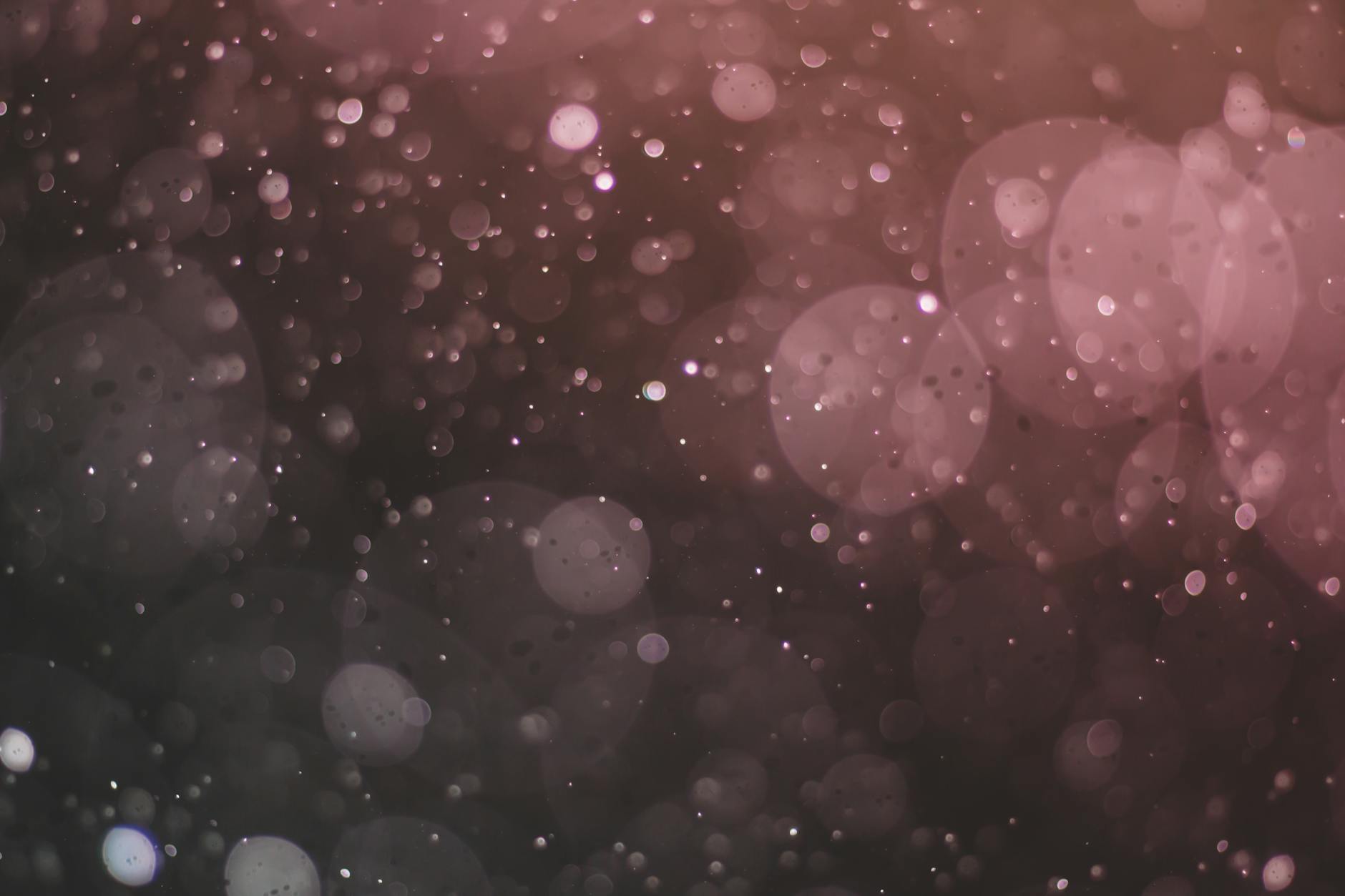 Elegant abstract image with a bokeh effect, displaying sparkles and a blurred background.