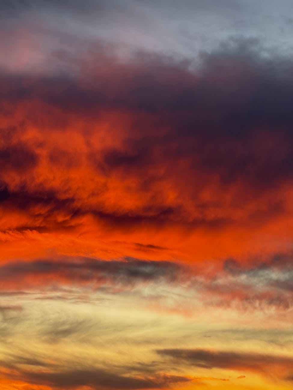 Vibrant red and orange sunset clouds create a dramatic atmosphere.