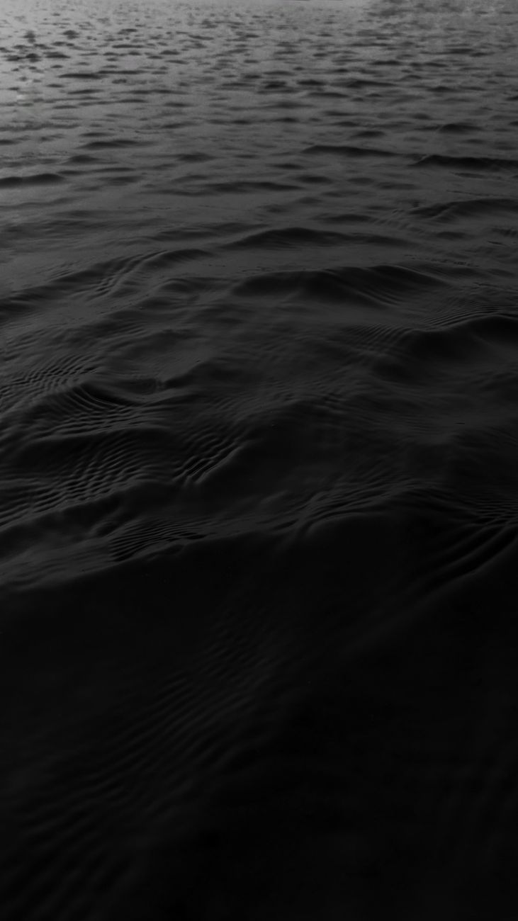 Serene monochrome ocean waves at day in Richhai, India, capturing tranquility.