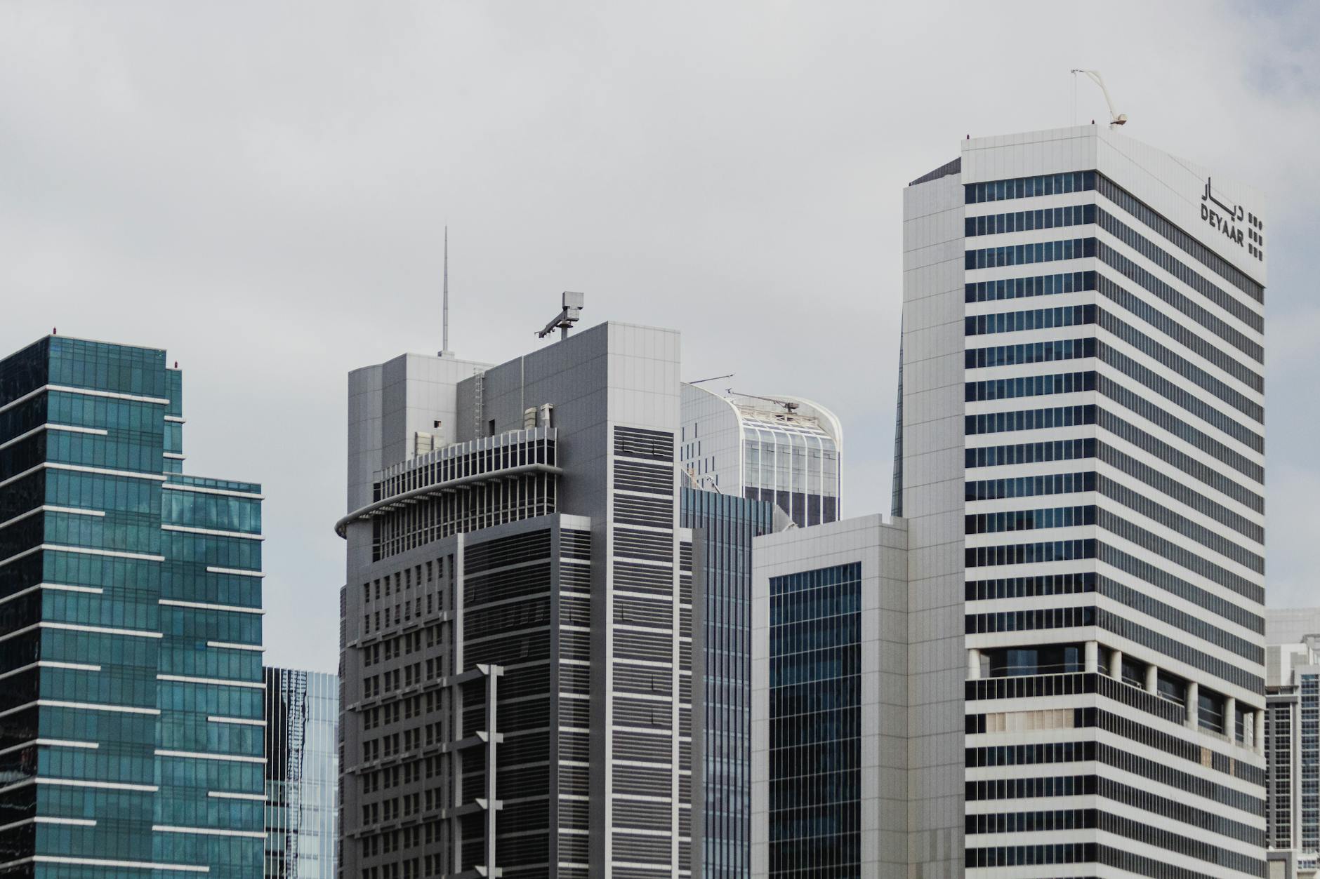 A skyline featuring modern skyscrapers with glass facades in an urban cityscape.
