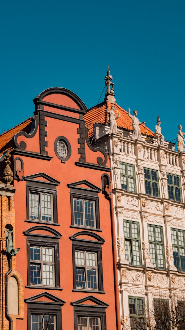 Vibrant facades of historic buildings in Gdańsk, Poland showcasing unique architectural styles.