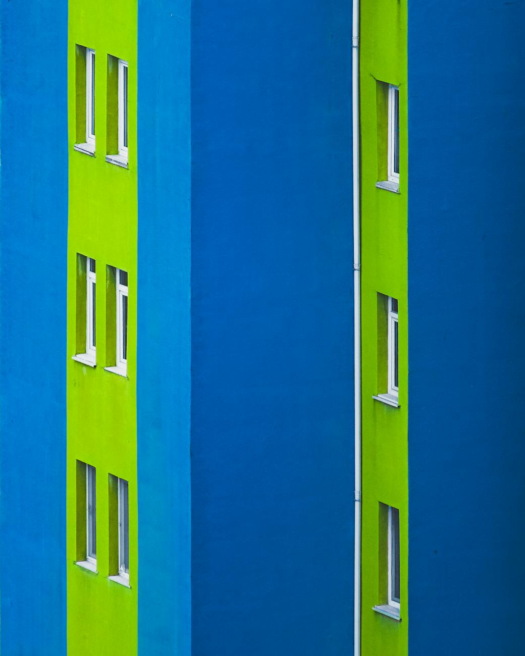 Vibrant blue and green building facade showcasing modern architecture in İstanbul.