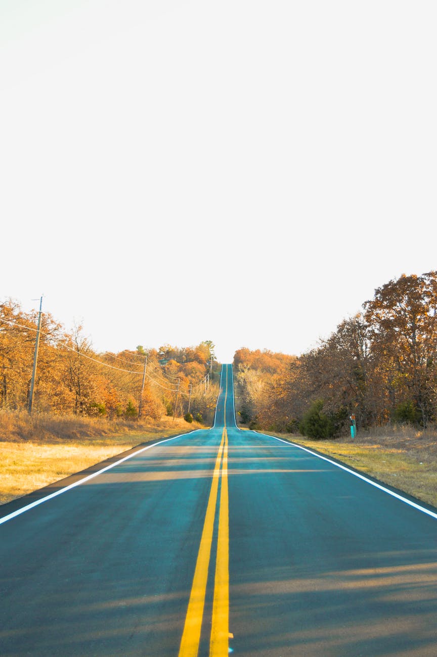Picturesque two-lane road in Sand Springs, Oklahoma, during fall