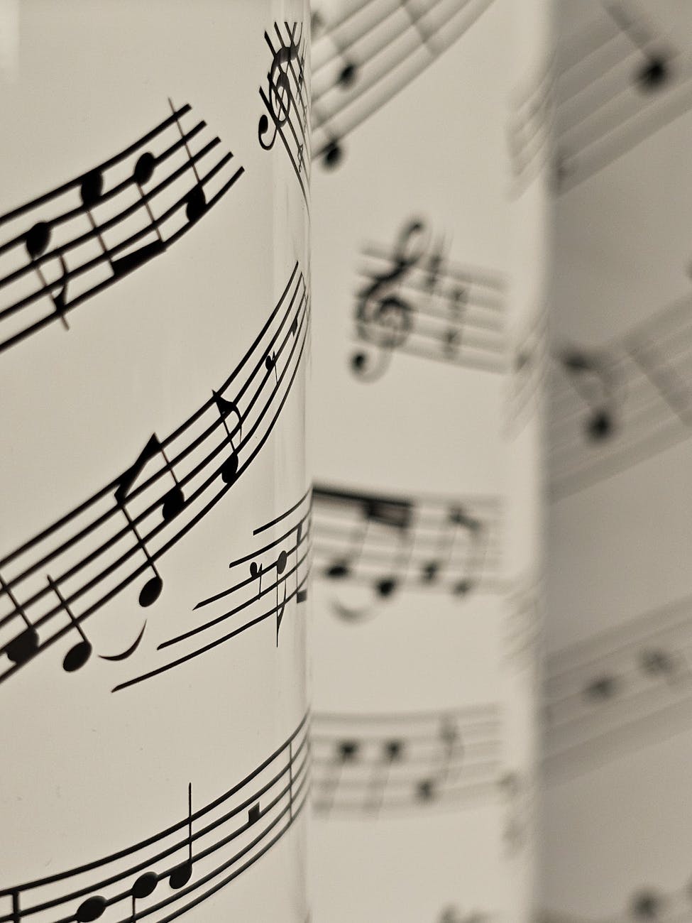 Detailed view of musical notes on sheets, highlighting artistic composition and design.