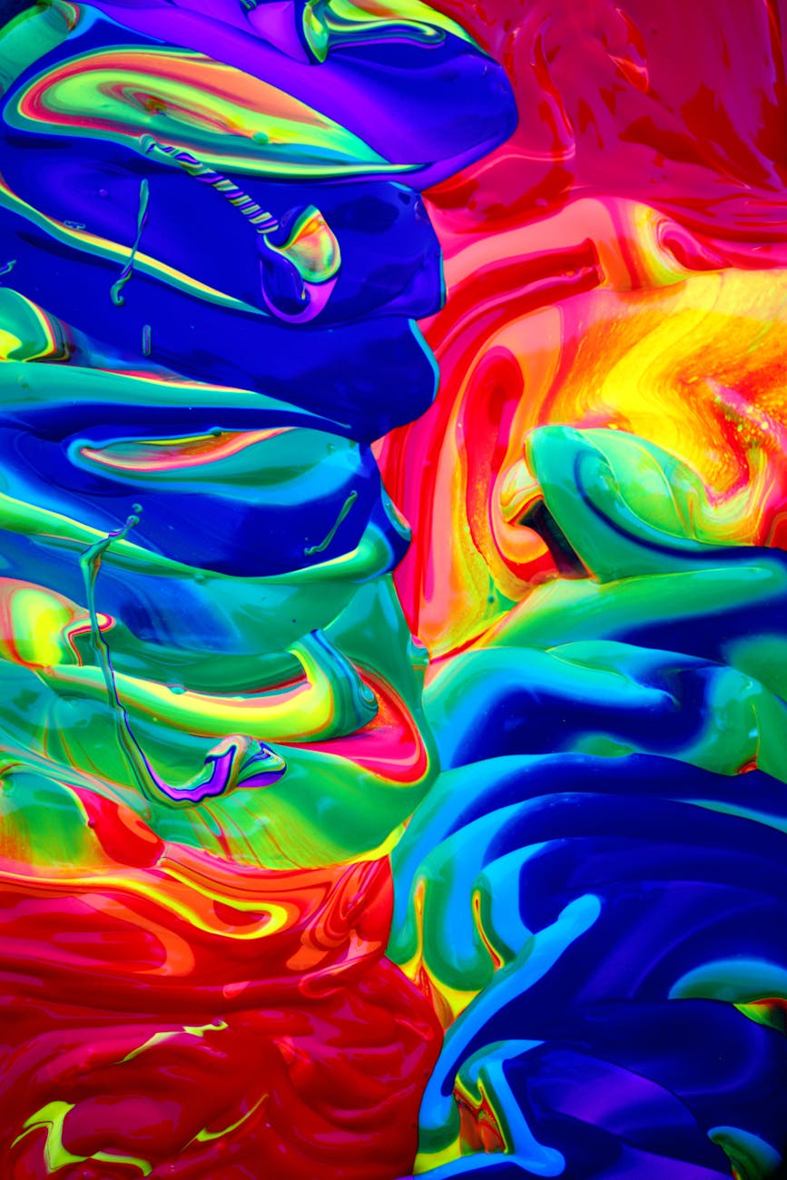 Dynamic abstract art with vibrant colors and fluid acrylic paint textures.