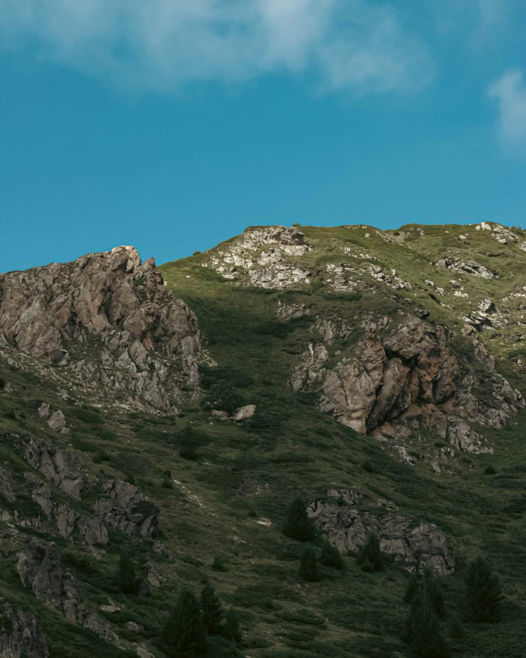 Stunning summer view of a rocky mountain landscape under a blue sky.