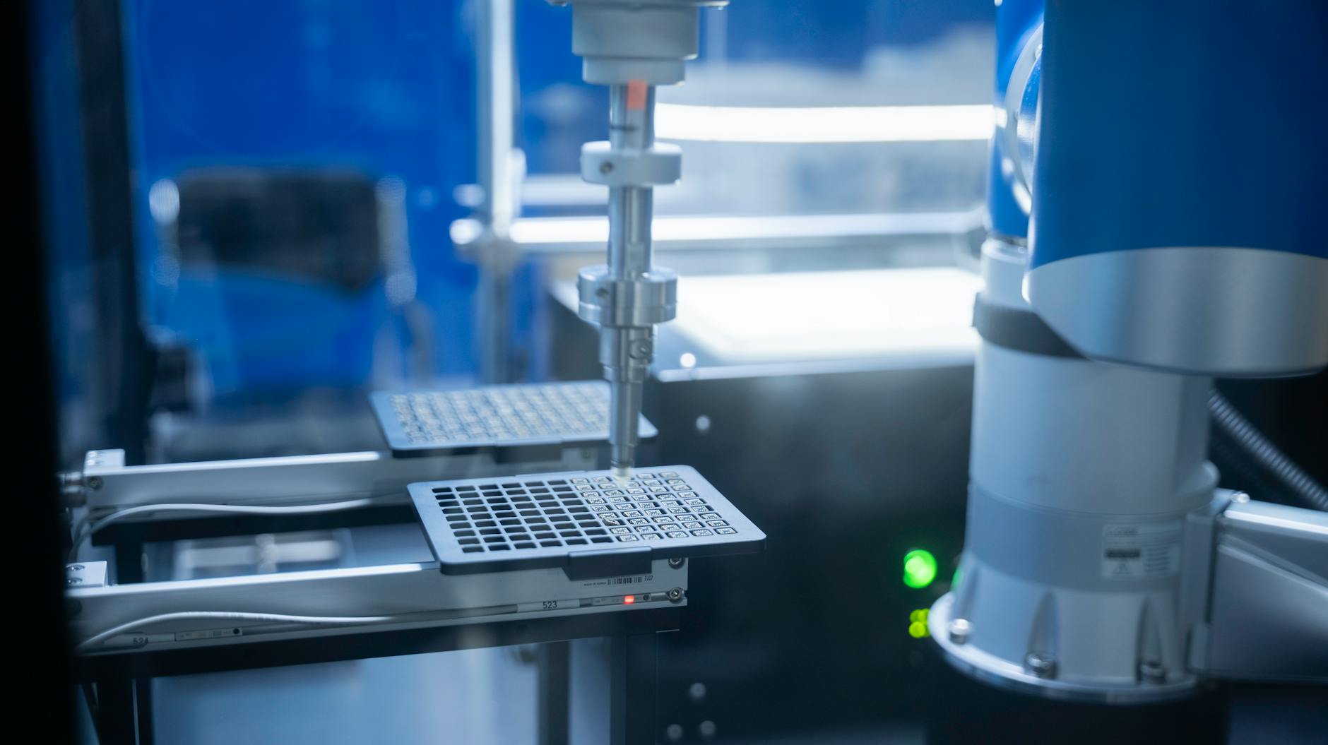 Close-up of robotic arm automating lab processes with precision.