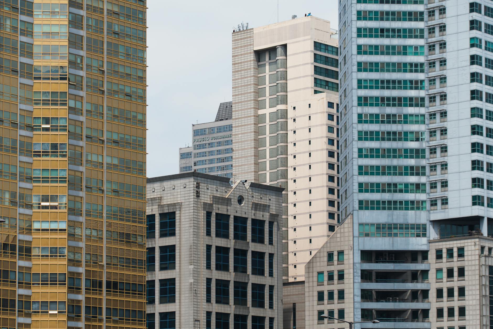 A cityscape featuring diverse modern skyscrapers showcasing architectural variation and urban density.