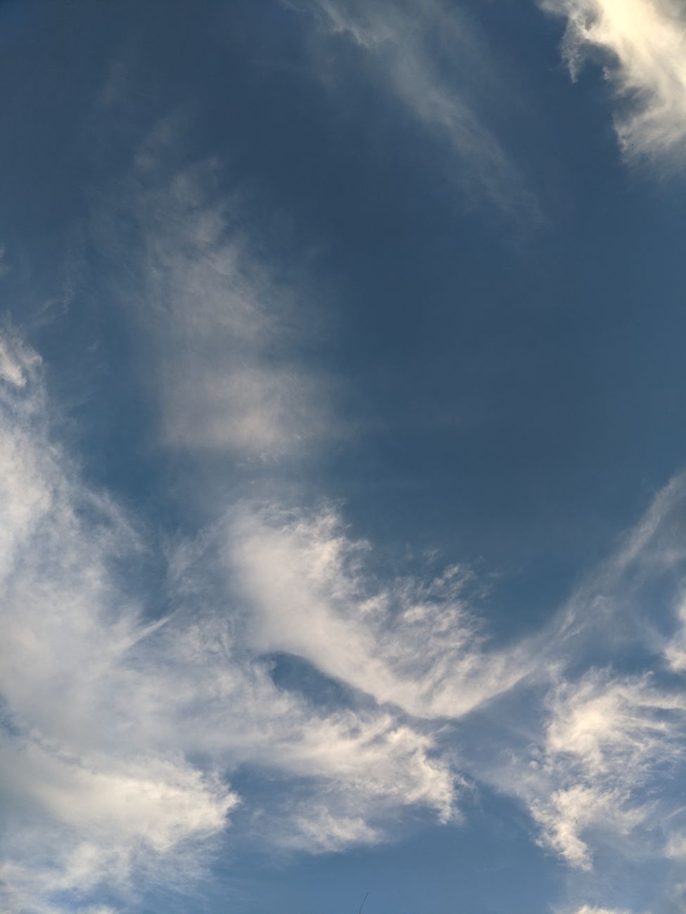 A stunning view of soft clouds against a clear blue sky, perfect for nature lovers and sky gazers.