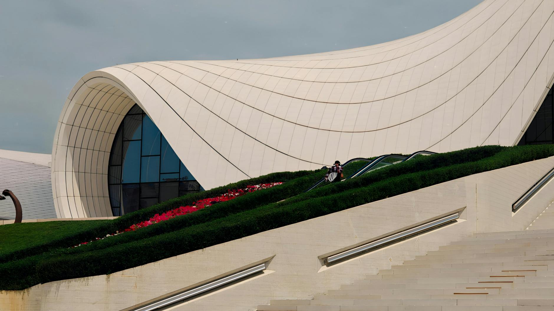 Modern building with unique design and lush greenery, ideal for architecture inspiration.