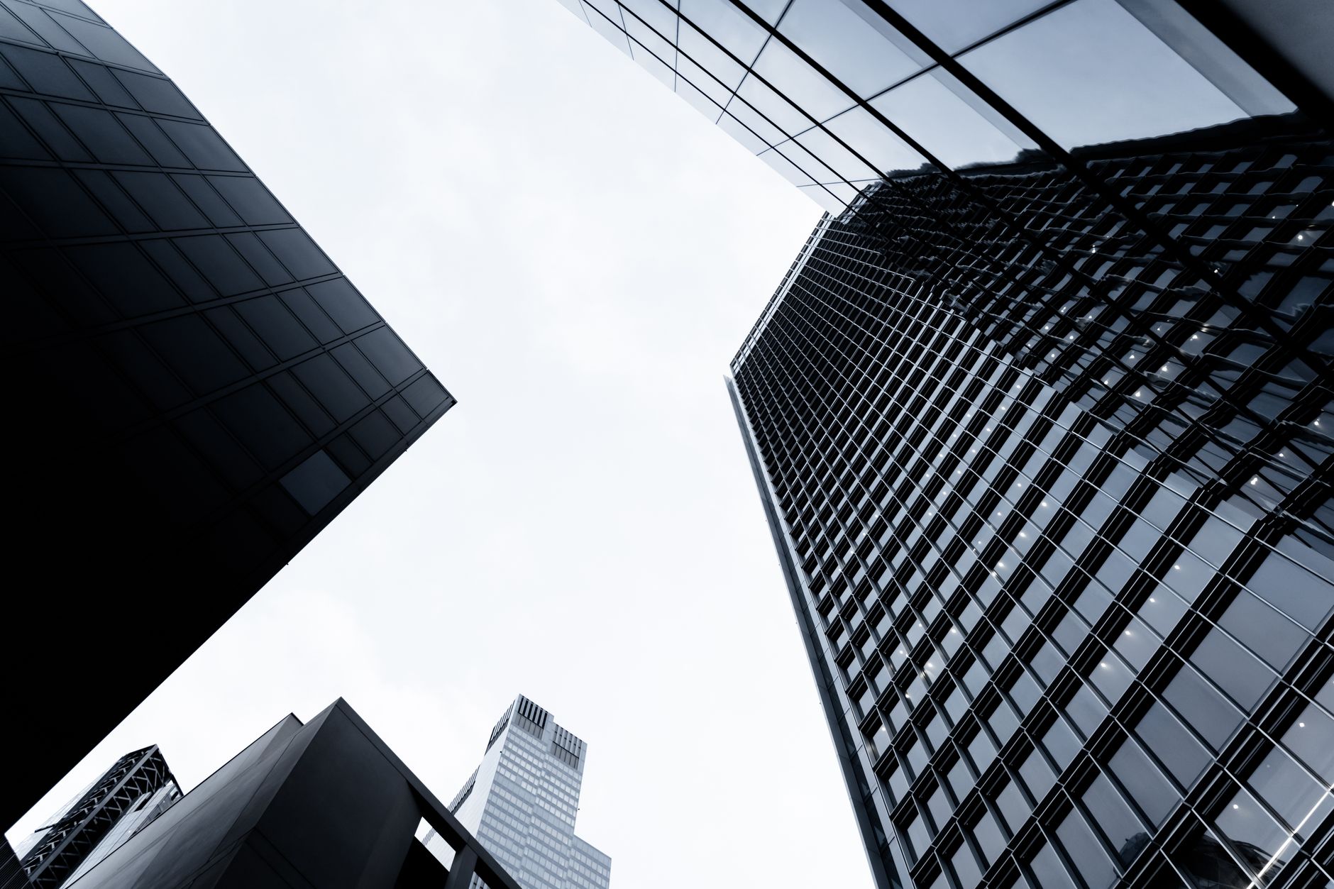 Low angle view of tall skyscrapers against the sky in London, showcasing modern architecture.