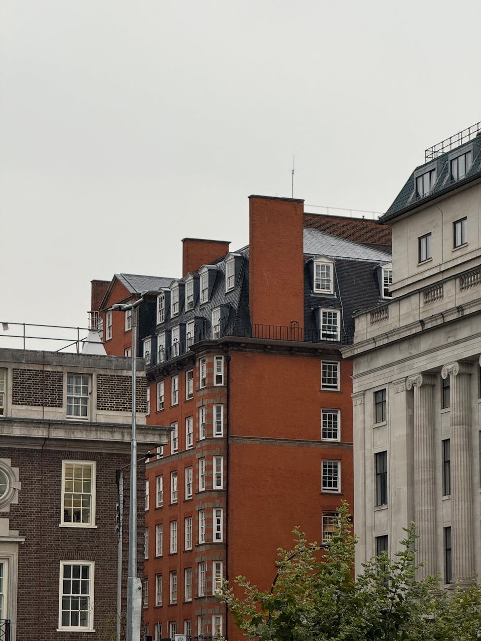 View of classic brick buildings in a cityscape showcasing historical architecture.