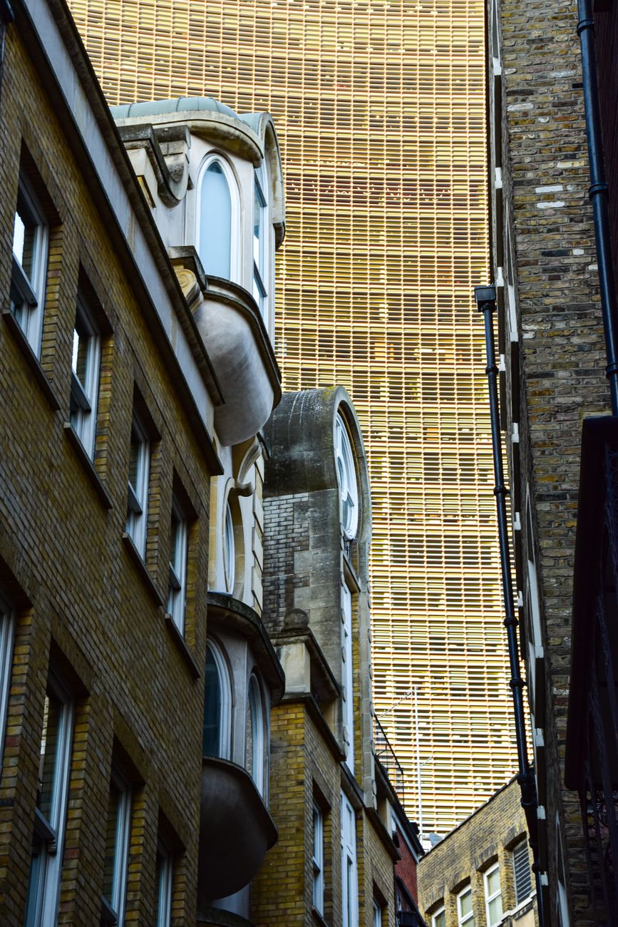 Elegant architectural contrast of classic and modern buildings in London.