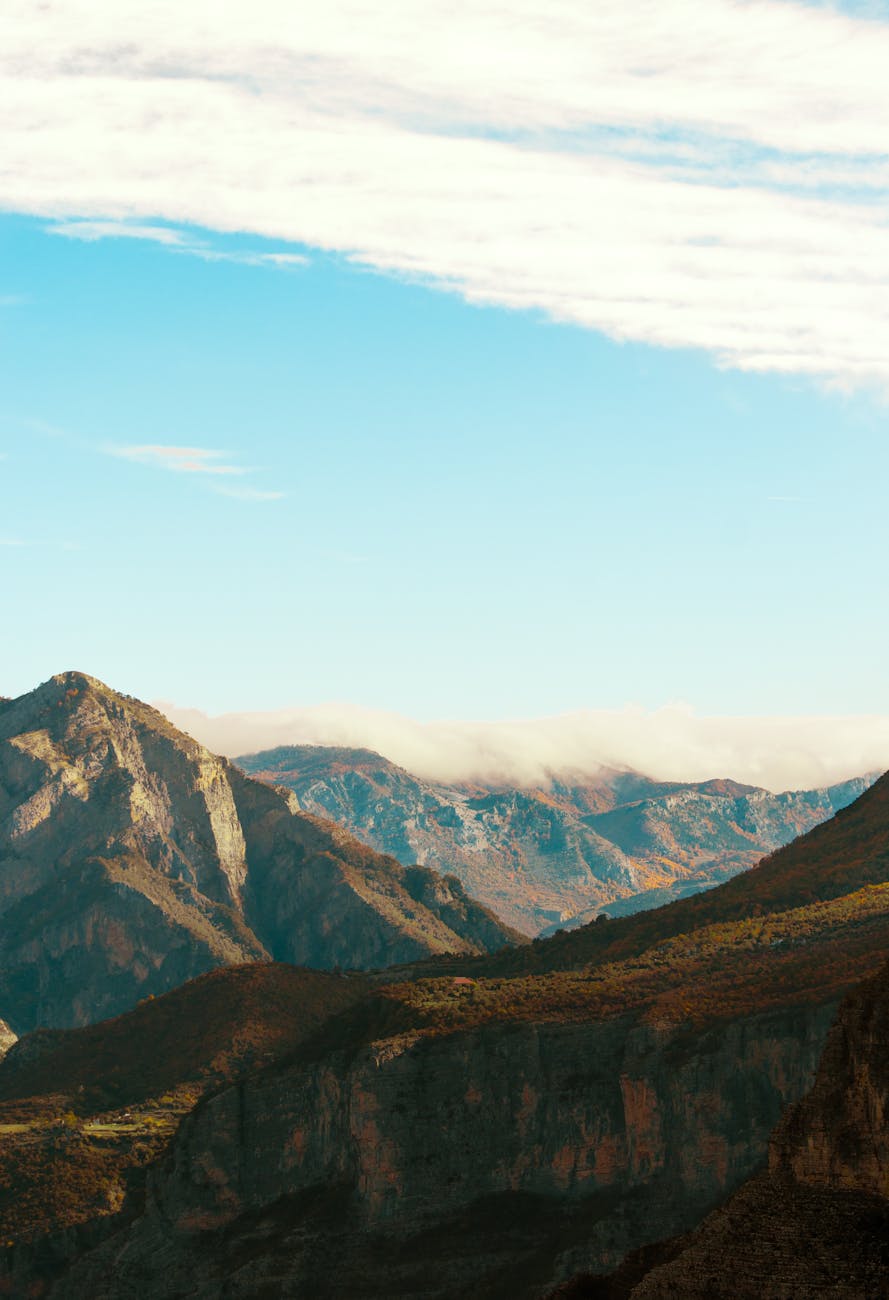 Breathtaking view of rugged mountains in Shkodër, Albania under a clear blue sky.