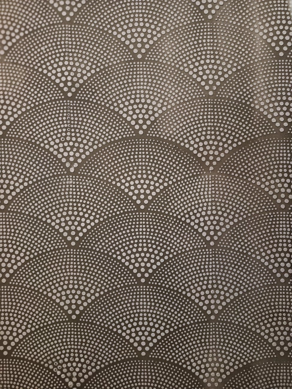 Seamless abstract geometric dot pattern in neutral tones suitable for backgrounds.