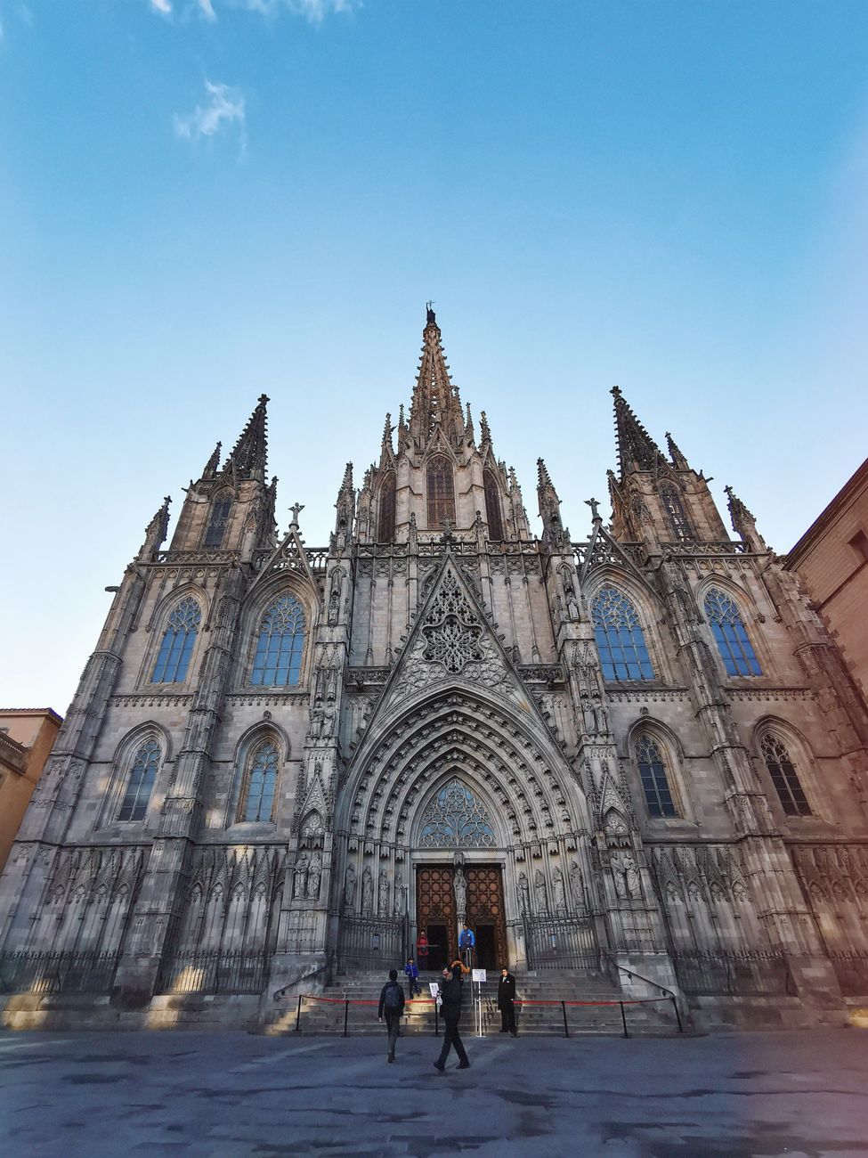 Stunning view of Barcelona's Gothic cathedral with clear blue sky and detailed architecture.