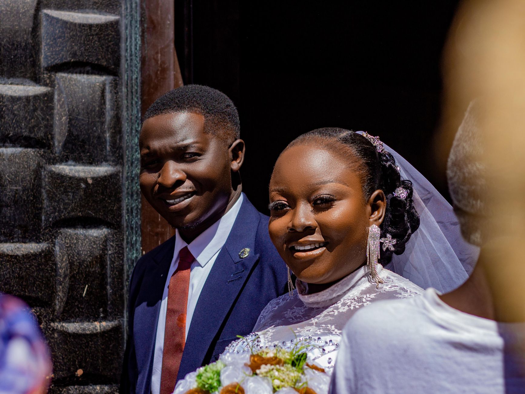 Happy couple celebrating their wedding day with smiles and love.