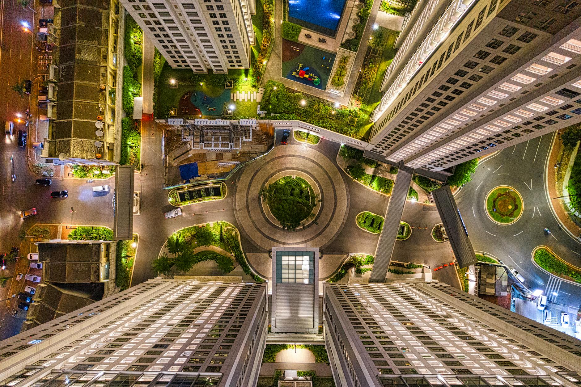 A stunning aerial shot of a modern cityscape in Banten, Indonesia during evening with illuminated buildings.