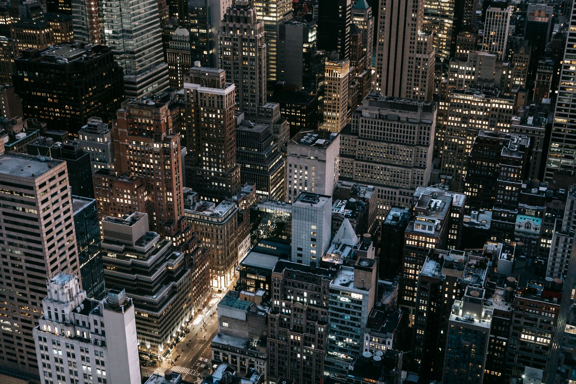 Stunning aerial view of New York City's illuminated skyline captured at night.