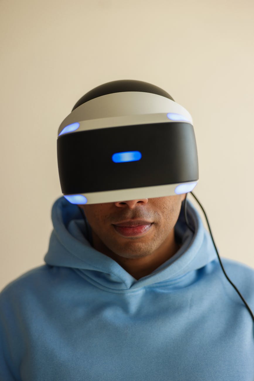 Adult male wearing a cutting-edge virtual reality headset indoors, immersed in VR simulation.