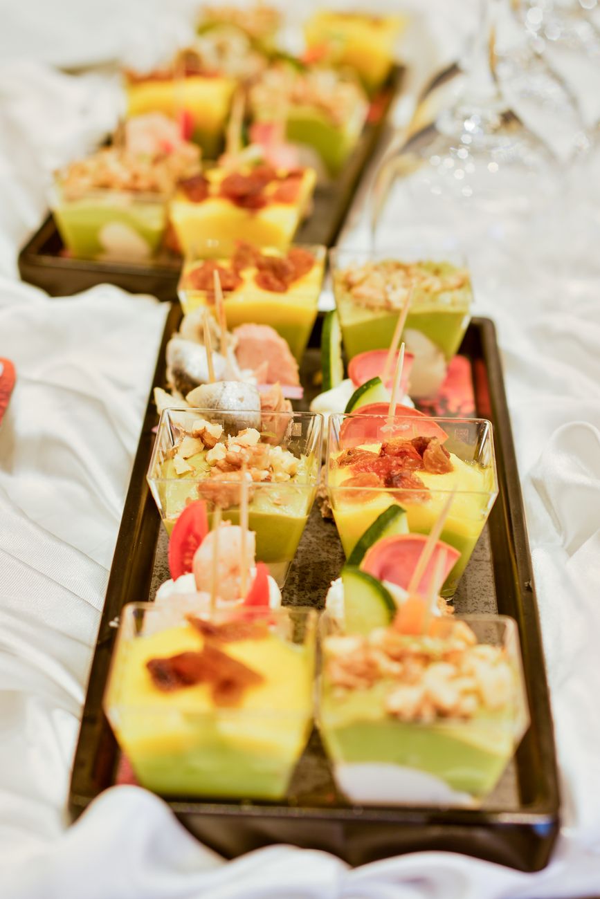 A vibrant assortment of mini appetizers beautifully arranged on a tray, perfect for events.