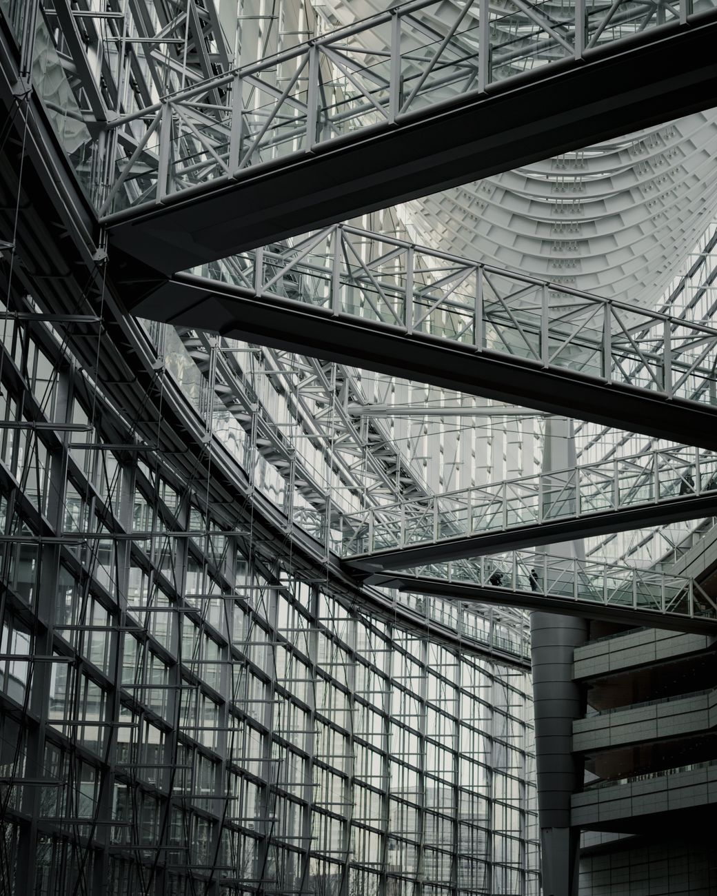 Intricate glass and steel design of a modern building in Tokyo, Japan.