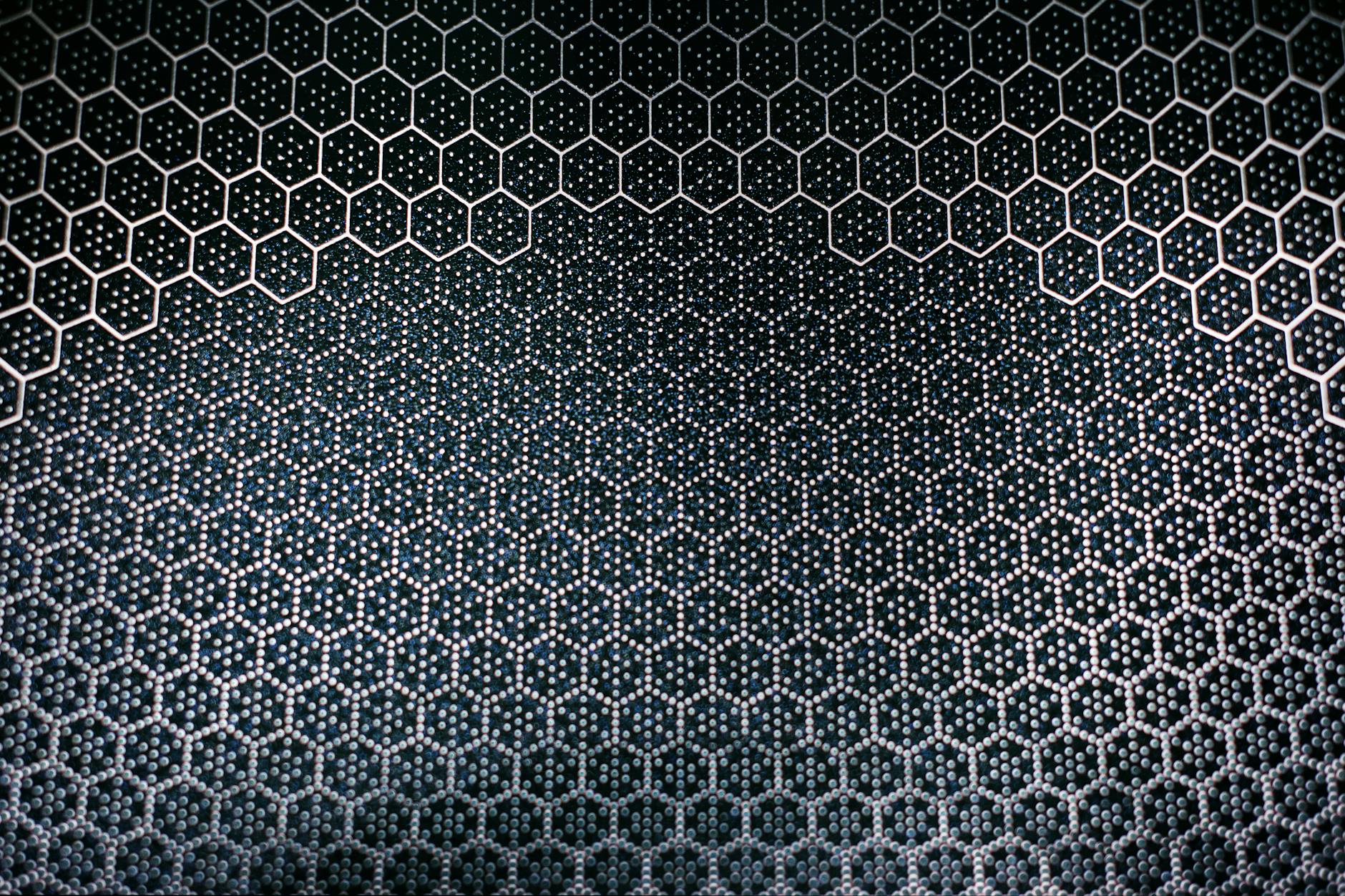 Abstract hexagonal metal pattern with textured surface. Ideal for design and technology backgrounds.