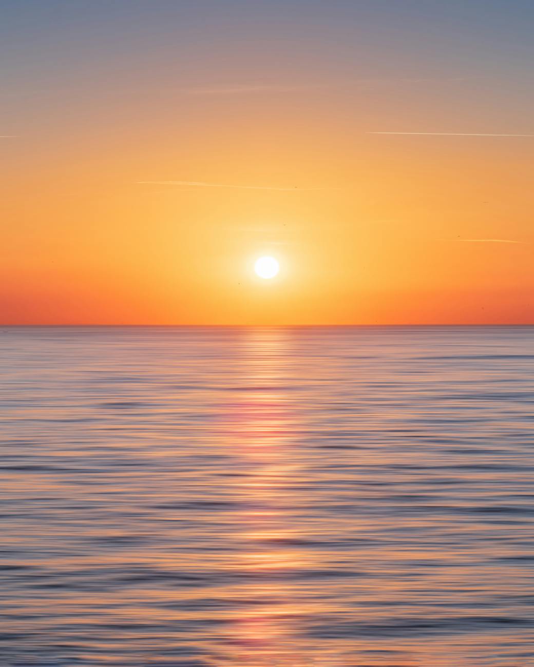 Serene ocean view during sunset in Kadıköy, Istanbul, showcasing a beautiful horizon and calm waters.