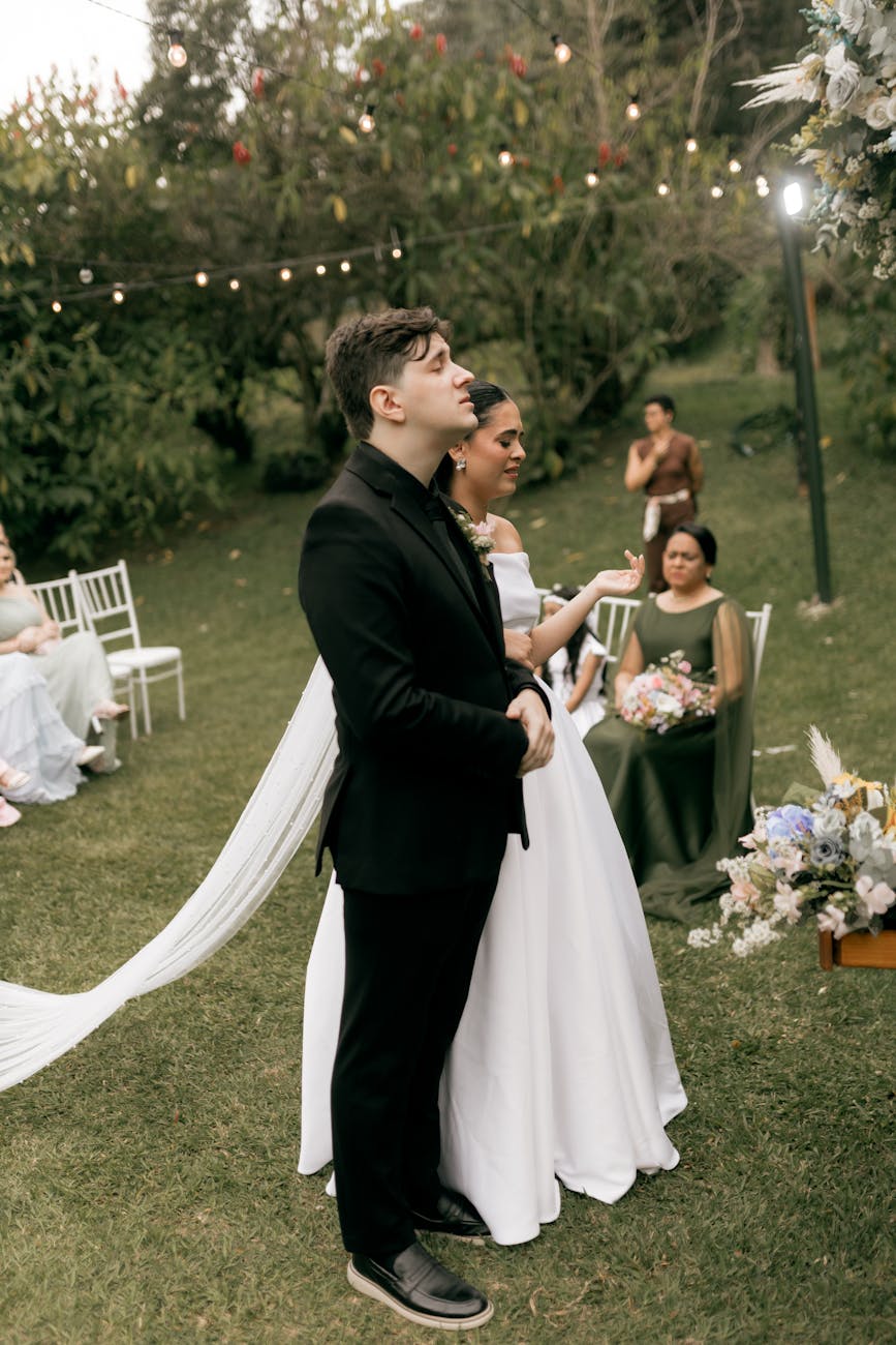 A vibrant outdoor wedding ceremony with a couple exchanging vows amidst nature.