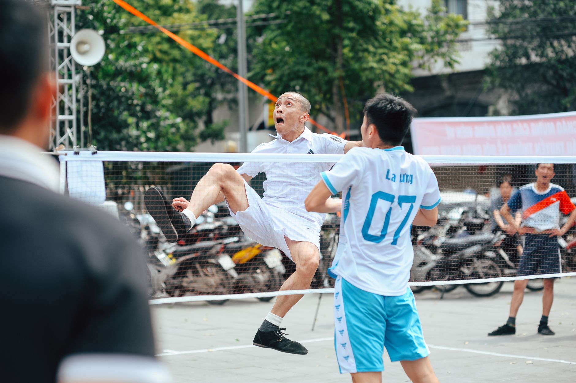 Dynamic action shot of a Sepak Takraw game, capturing intense focus and athleticism.