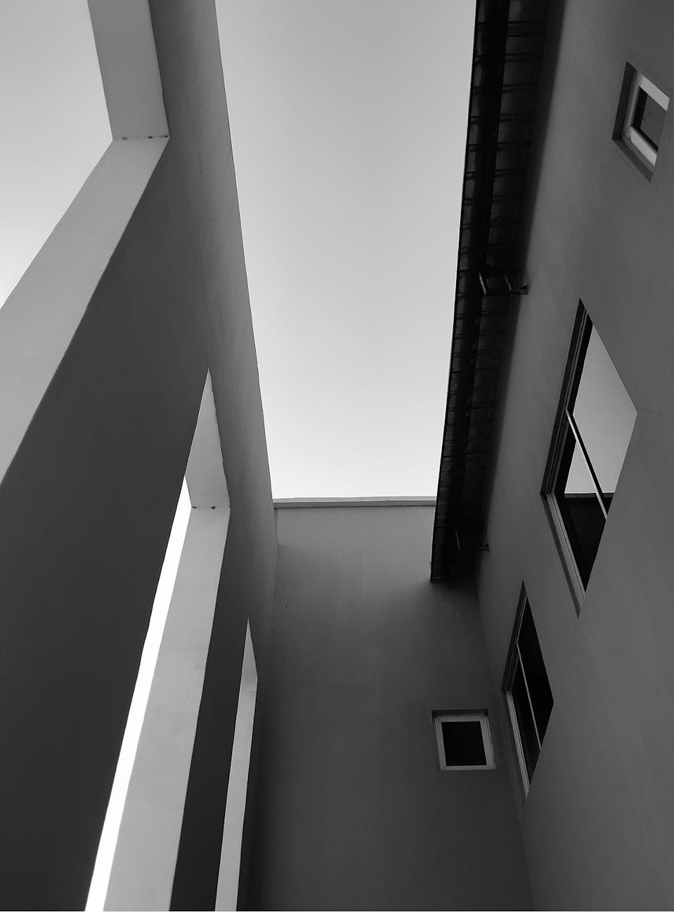 Dramatic black and white photo showcasing modern architectural lines and angles.