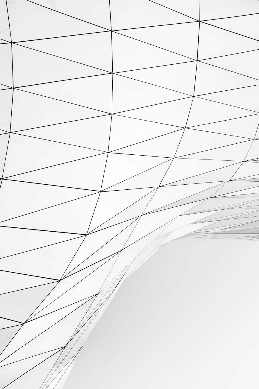Minimalistic abstract design featuring white geometric lines on a curved surface.