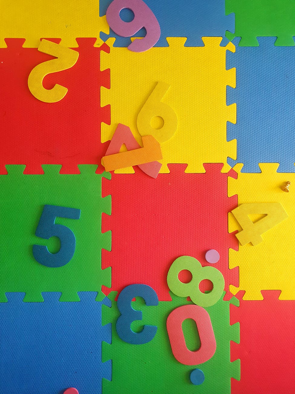 Vibrant interlocking foam mat with numbers for children's play and learning.