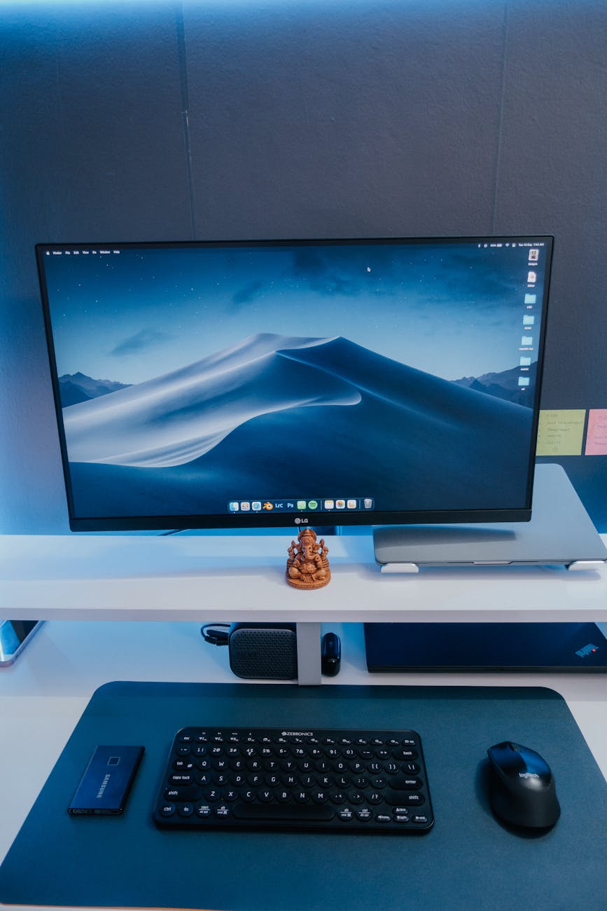 A tidy workspace featuring a computer monitor, keyboard, and mouse, ideal for productivity.