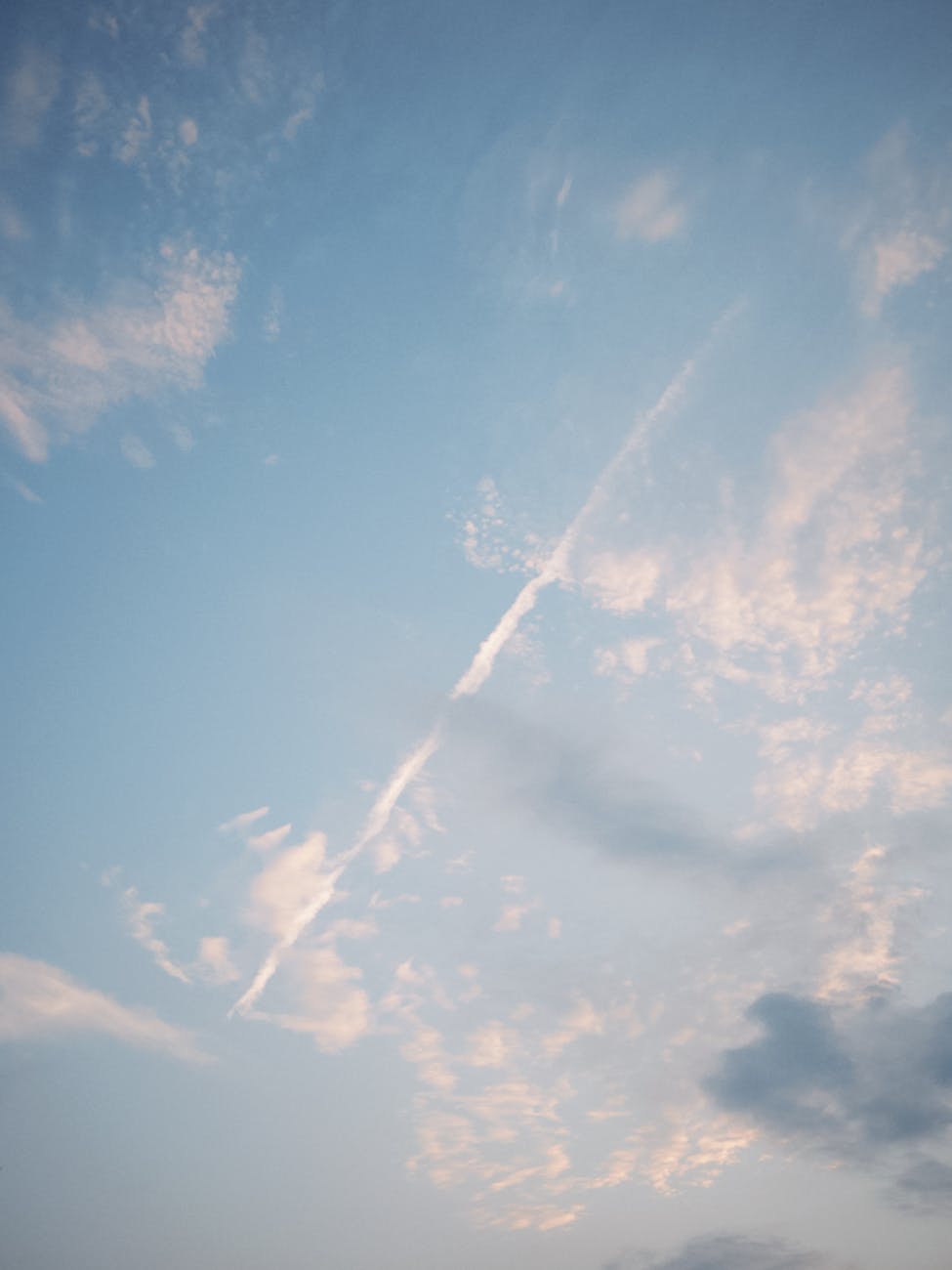 Calm and soothing sky filled with soft clouds, perfect for a serene background.