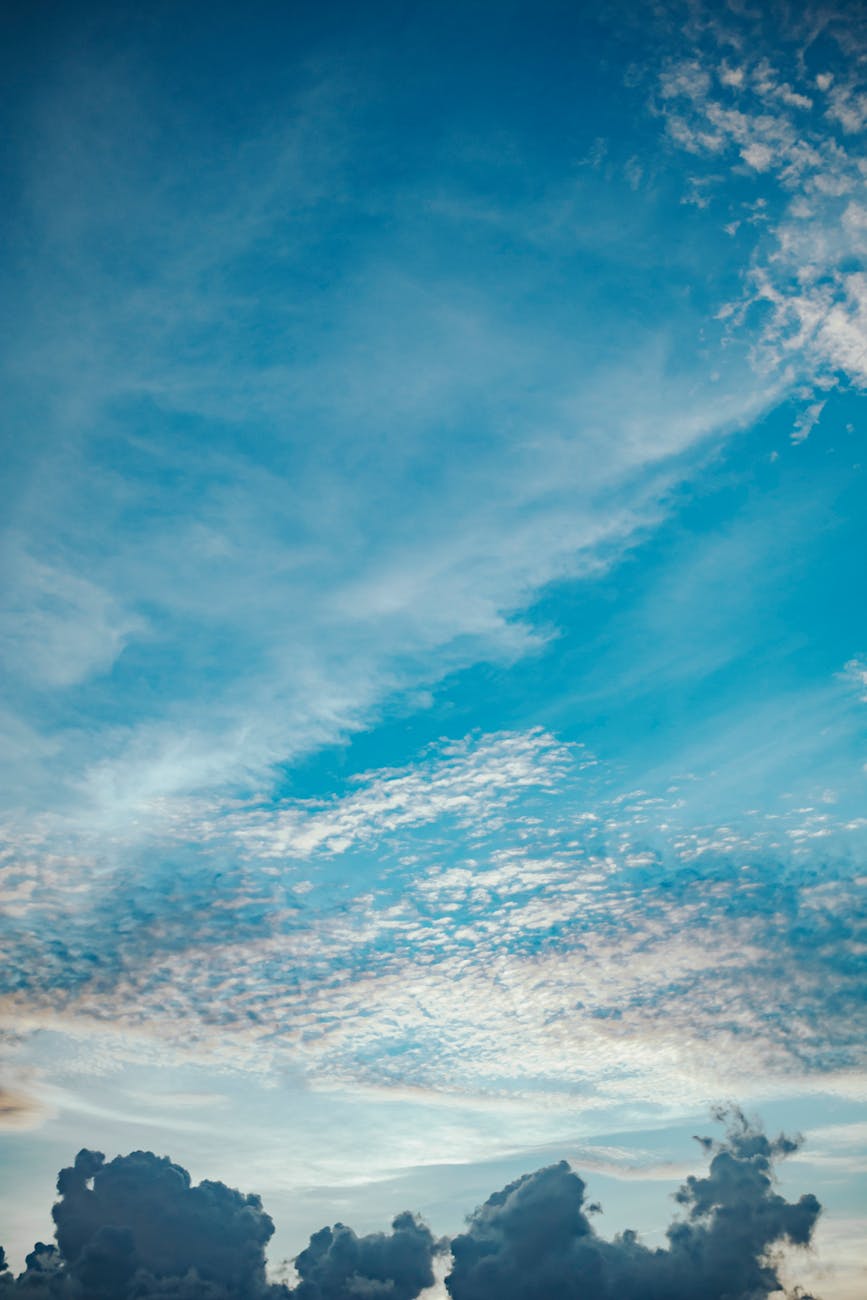 Beautiful blue sky filled with fluffy clouds, creating a serene and peaceful atmosphere.