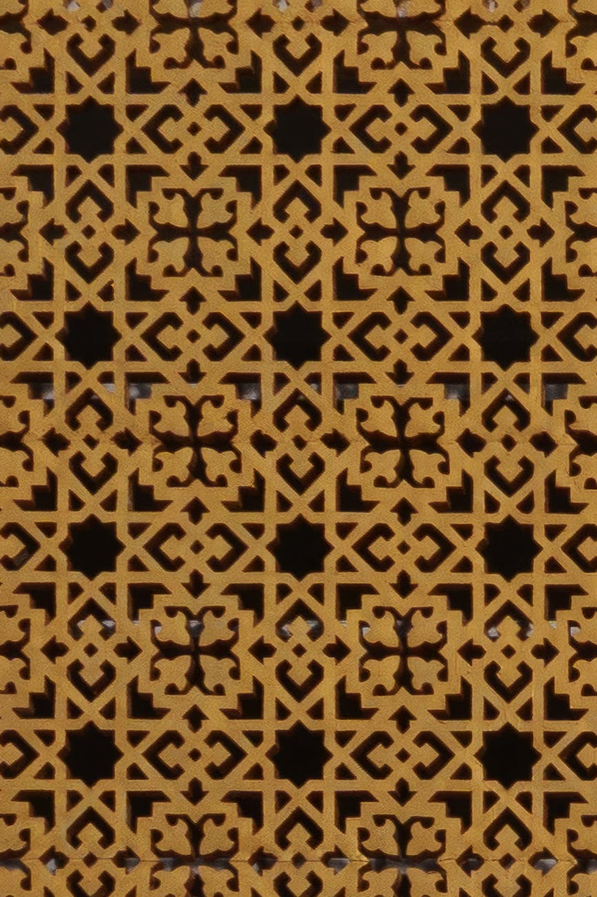 Close-up of a detailed Islamic geometric pattern showcasing intricate arabesque design and craftsmanship.