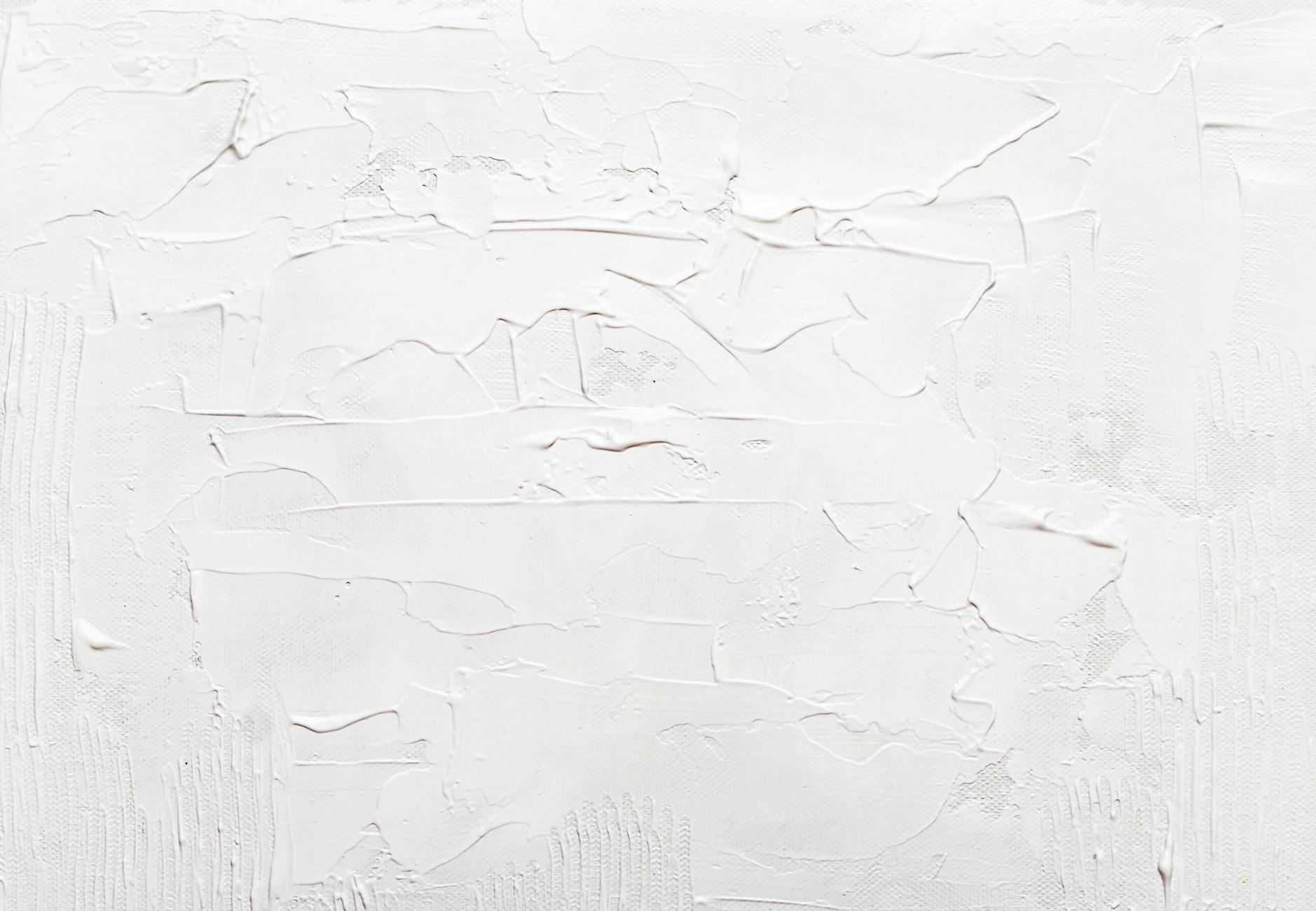 Close-up of a textured and painted white abstract surface, ideal for backgrounds.