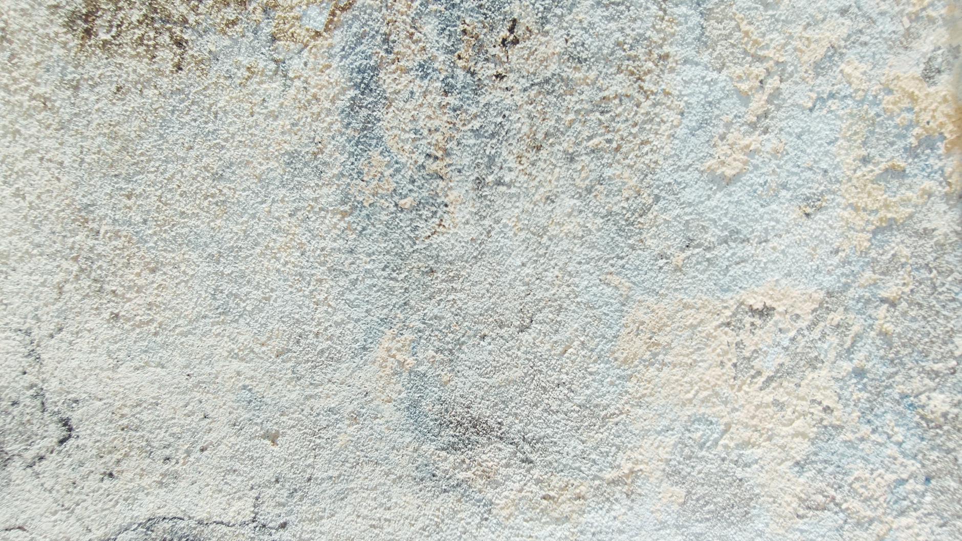 Close-up of a textured surface with gentle pastel tones, creating an abstract and artistic effect.