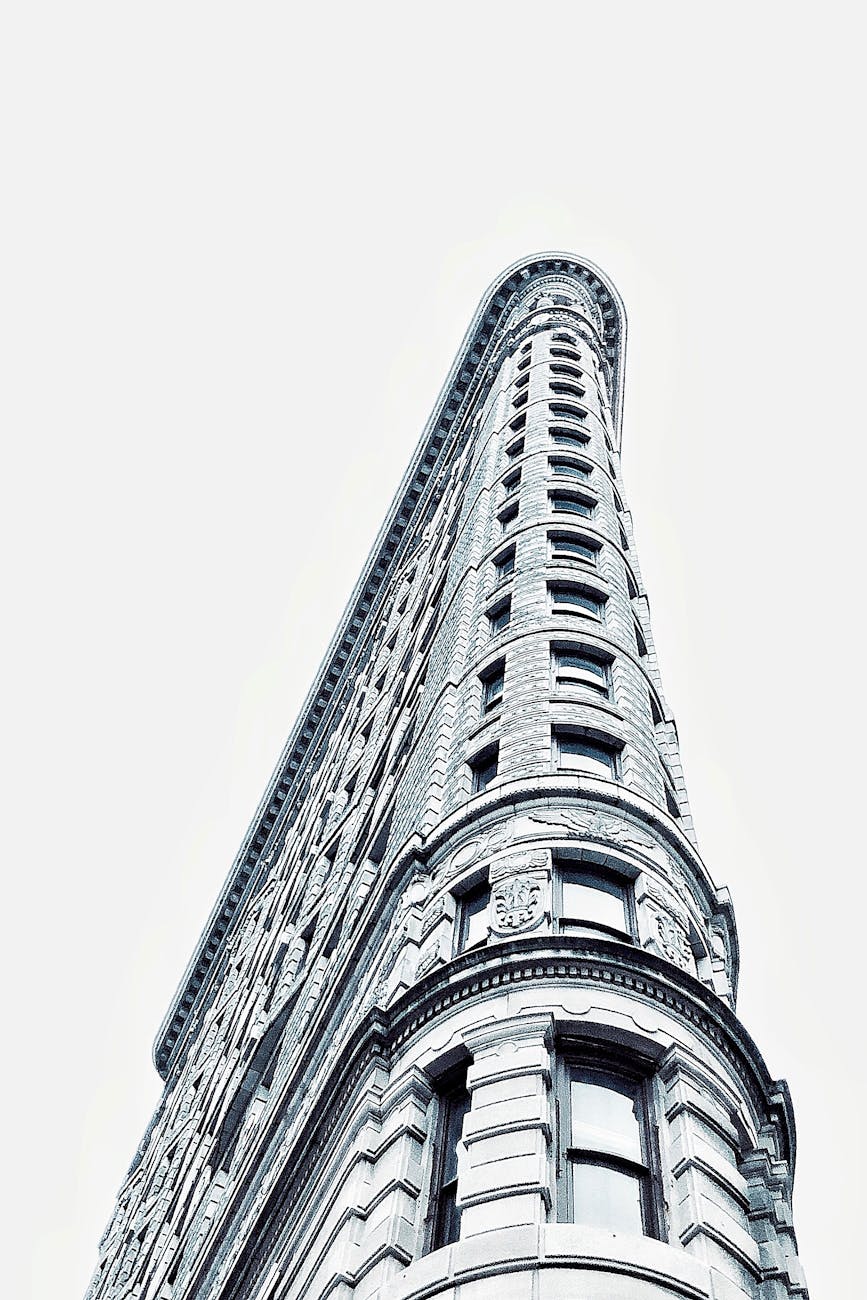 Modern architectural marvel of the Flatiron Building captured from a low angle in New York City.