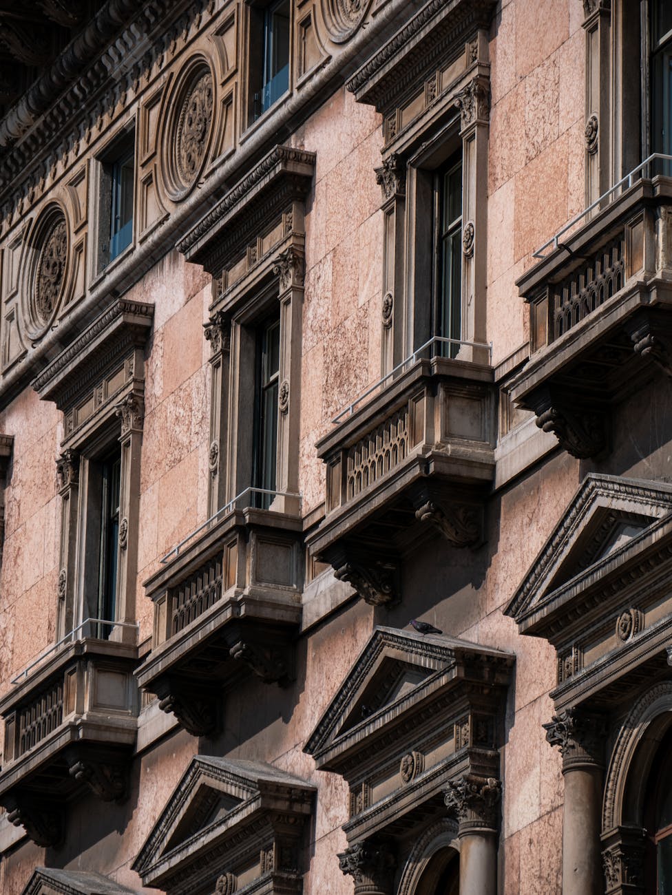 Elegant classical building facade showcasing ornate architectural details and rich textures.