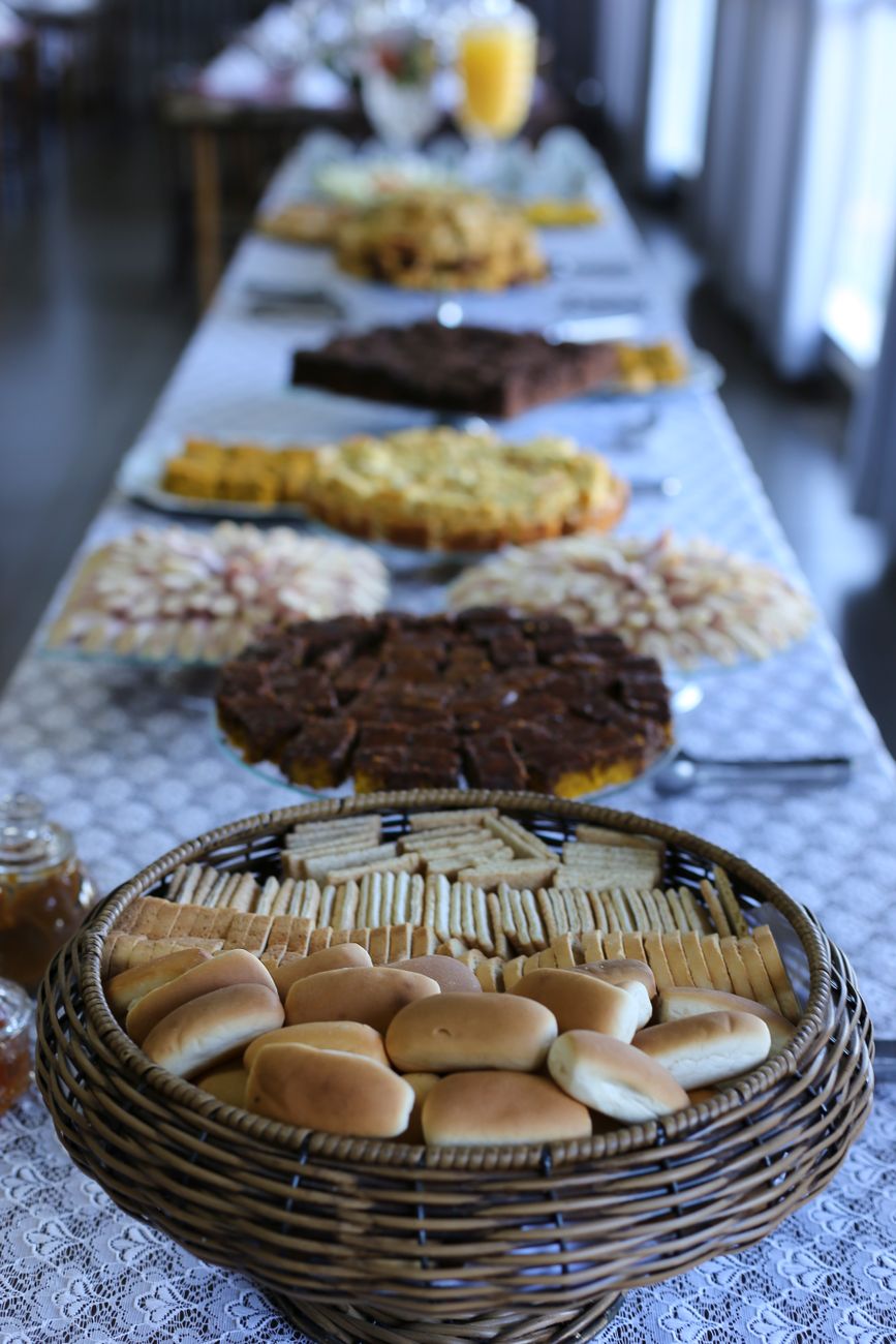 A beautifully arranged buffet table features an array of breads and pastries, perfect for an event.