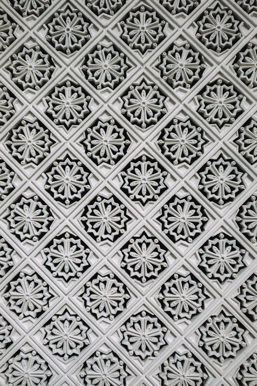 Intricate geometric design from Malaysian architecture showcasing detailed craftsmanship and symmetry.