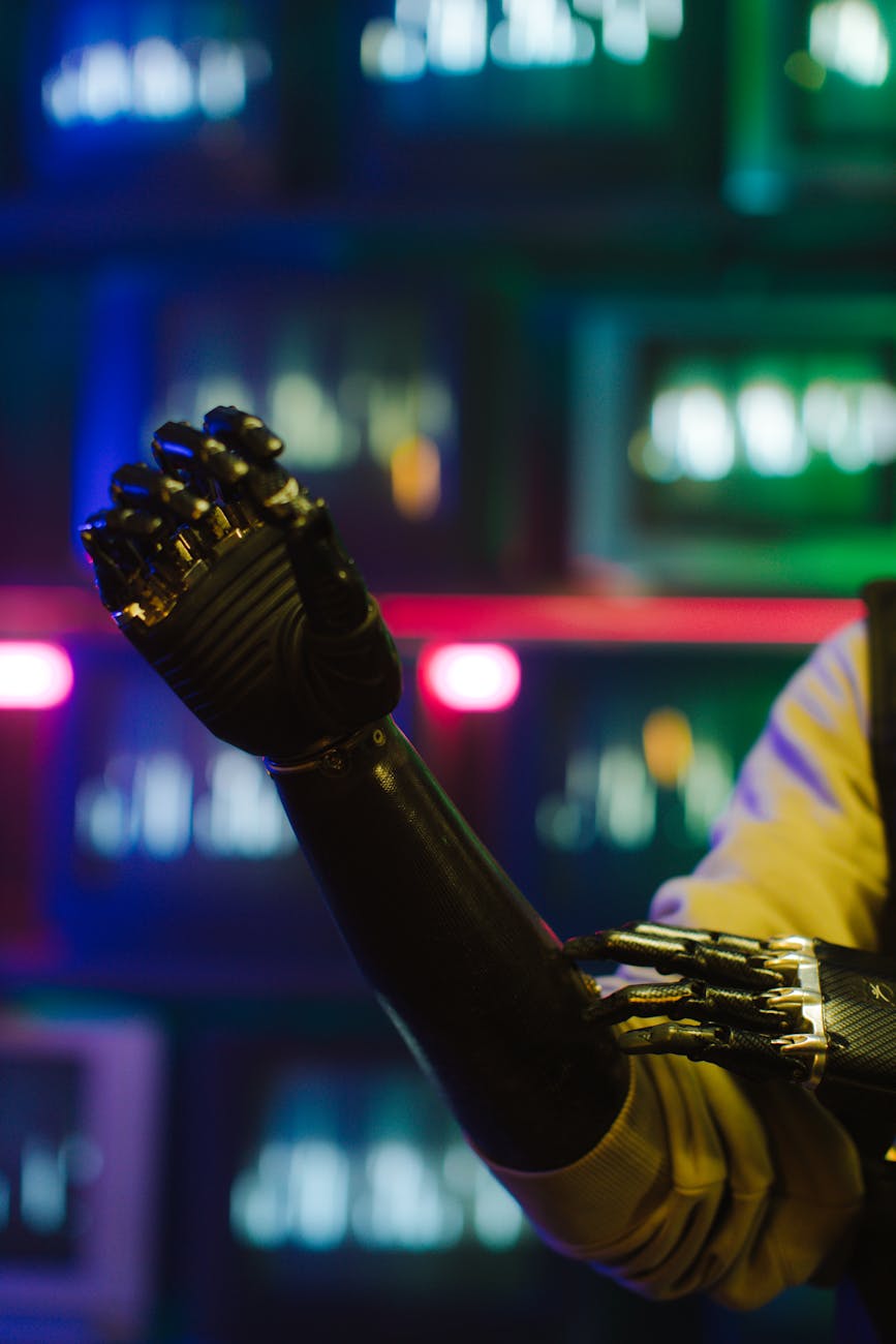 Close-up of a cybernetic prosthetic arm with chrome detailing under vibrant neon lights, conveying a cyberpunk theme.
