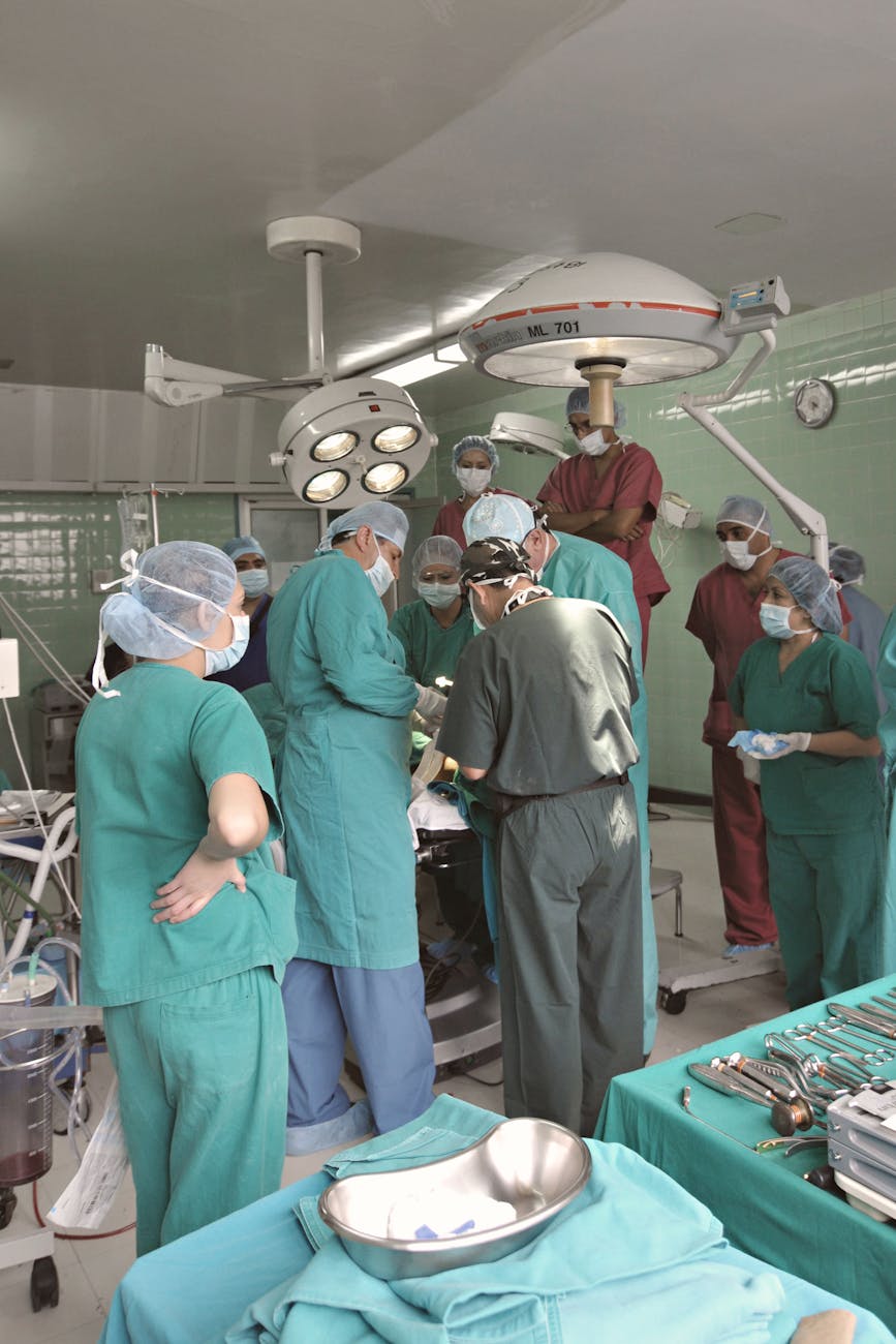 A team of surgeons working in an operating room, showcasing teamwork and medical expertise.