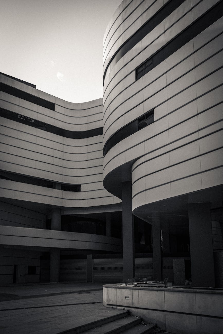 Captivating grayscale image of a modern curved architectural facade.