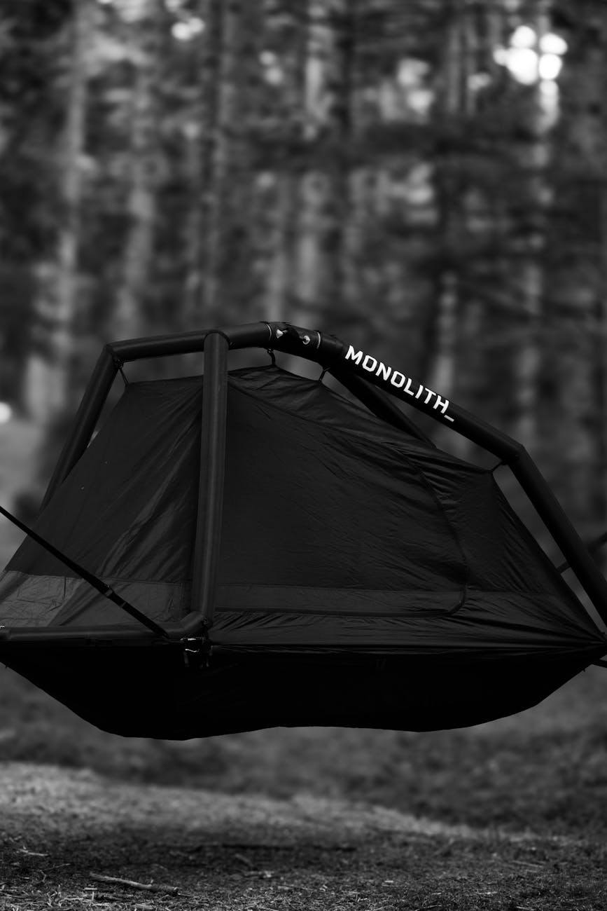 A black Monolith tent hanging in a forest in Bolu, Türkiye.