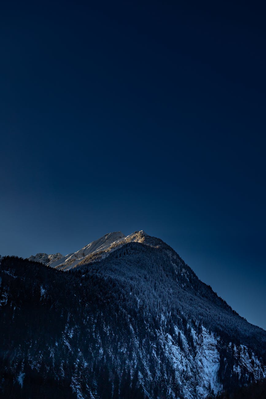 Breathtaking view of snow-covered mountain peaks at dusk in Mayrhofen, Tirol, Austria.