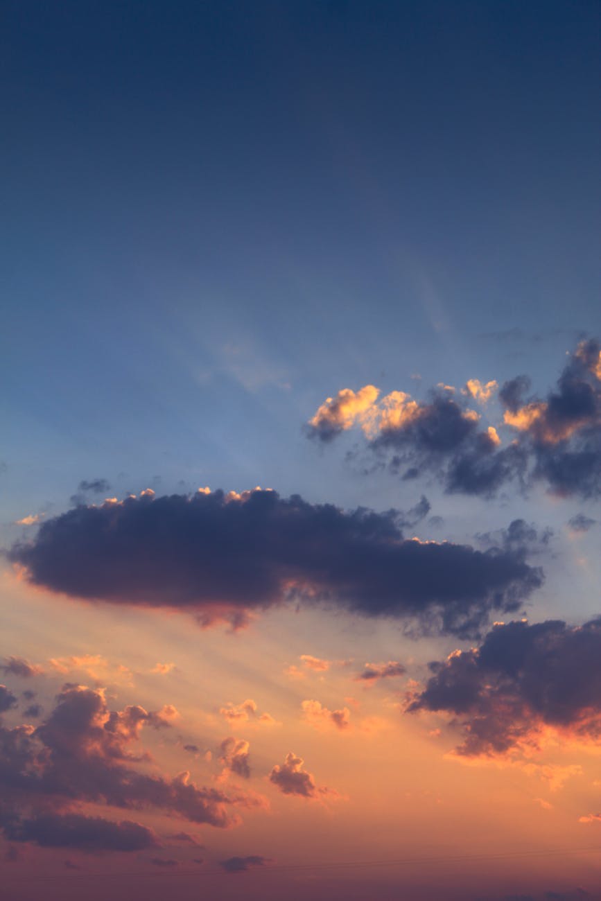 Captivating view of a vibrant sunset sky filled with dramatic clouds, offering a serene natural beauty.